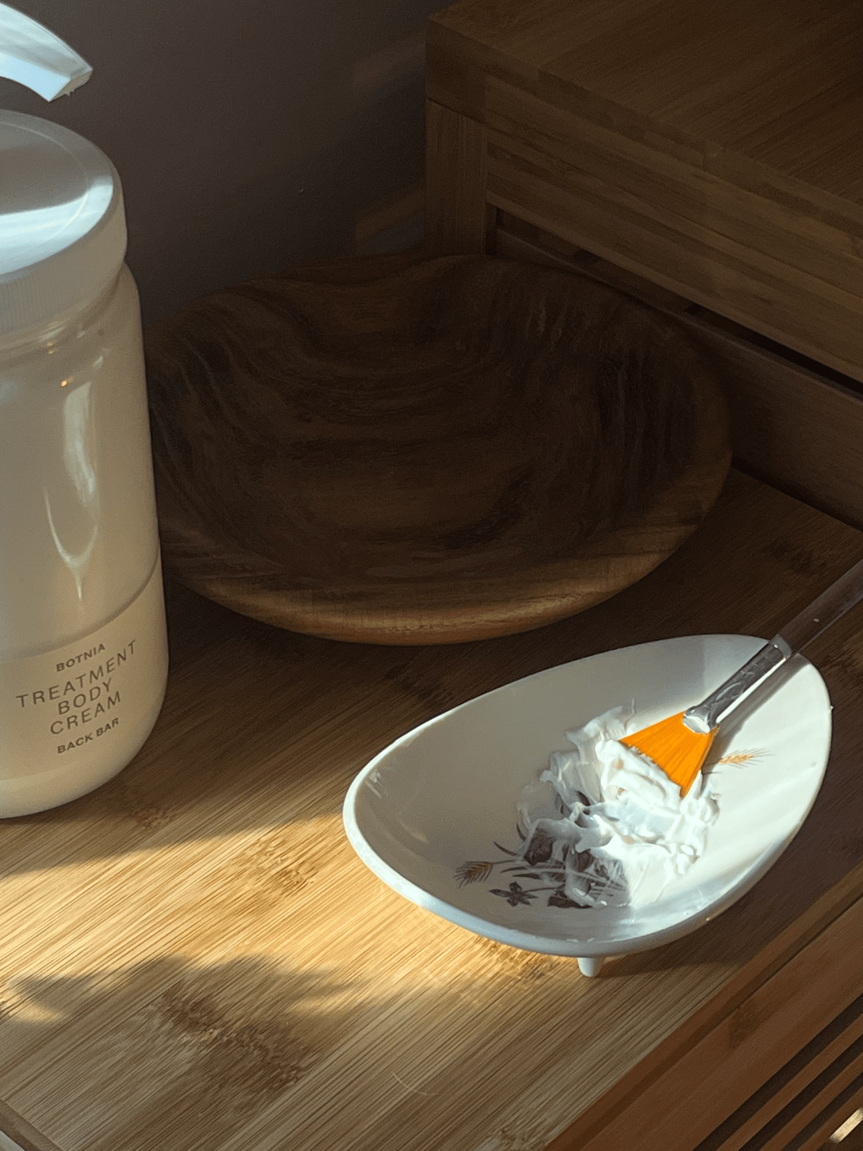 Botnia mask preparation — warm light, botanical ingredients